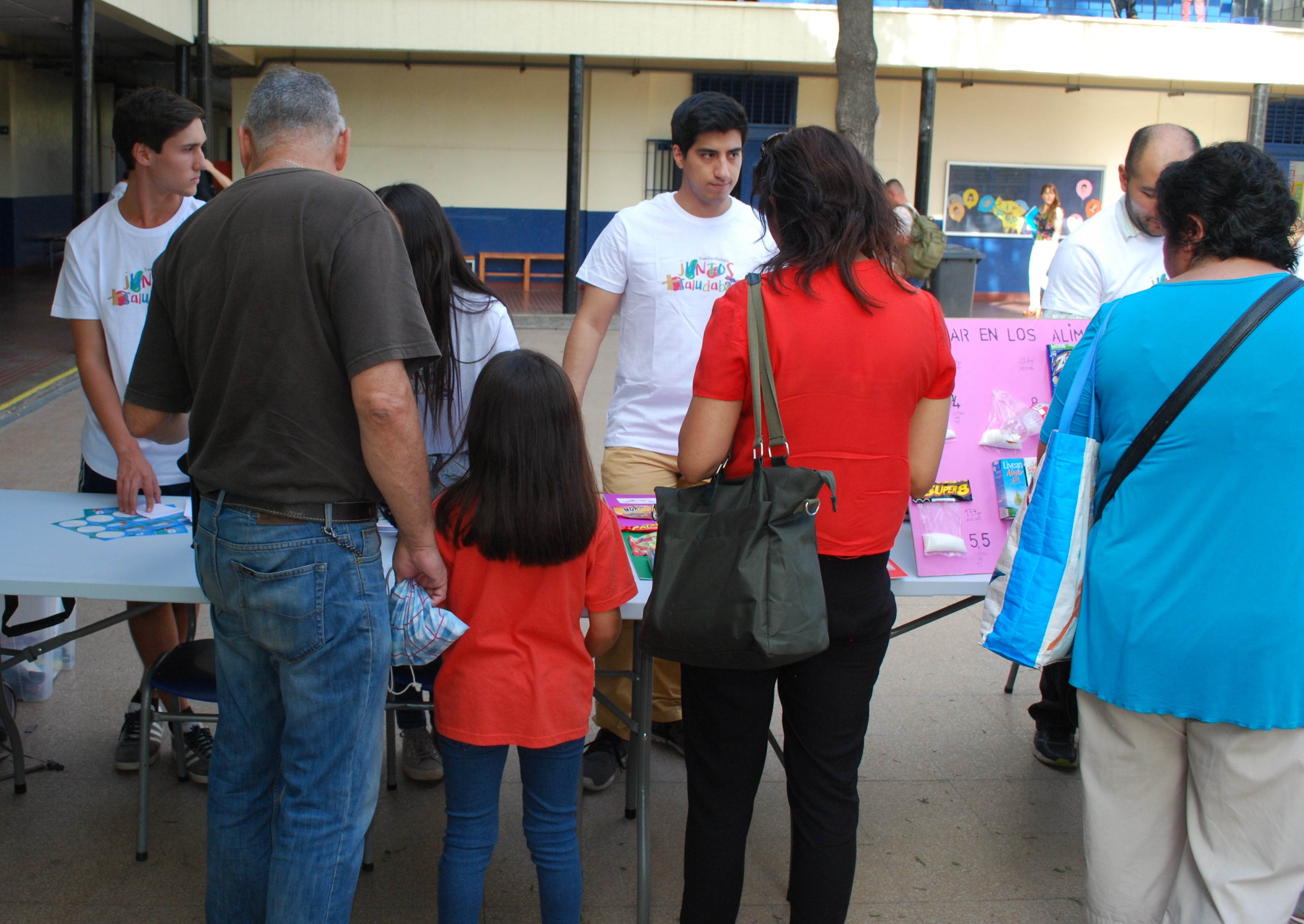 a group of people view poster boards