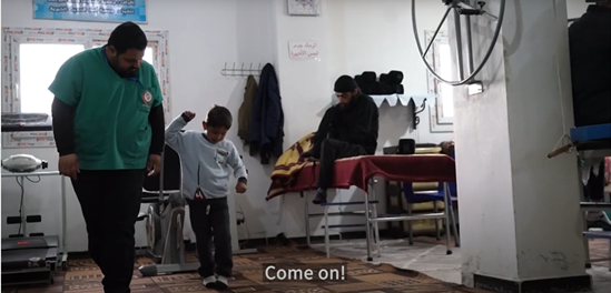 Child undergoing rehabilitation by a health worker following the 2023 earthquake affecting North West Syria