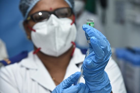 Loading the syringe with Covisheild Vaccine